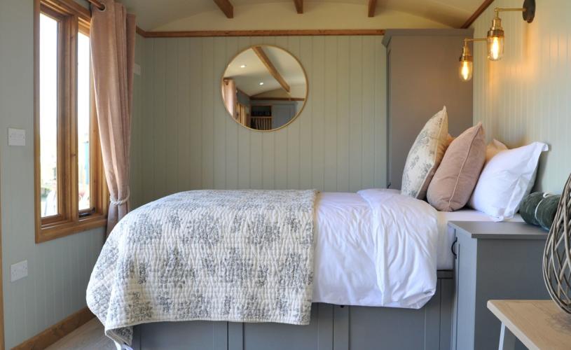 Bed in Warblers' Meadow shepherd hut at WWT Slimbridge - Credit WWT Slimbridge