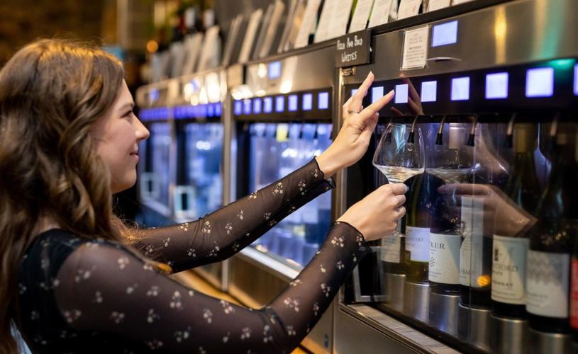 Woman choosing wine from Enomatic machine at Le Vignoble Bristol - credit Le Vignoble