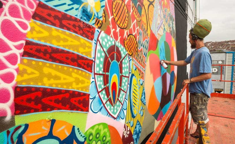 Louis Masai painting at Upfest 2016 in Bedminster, Bristol - Credit Plaster