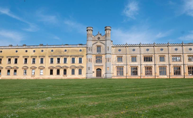 The south face of the Ashton Court mansion. The left side and the right side have similar but not identical designs. A gatehouse is in the middle of the two sides - credit Bristol Design