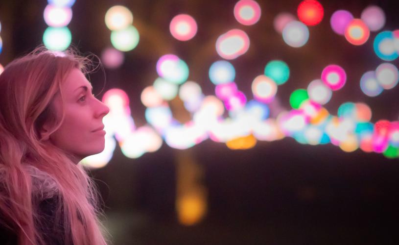 Woman looking at light installation - credit Ash Mills
