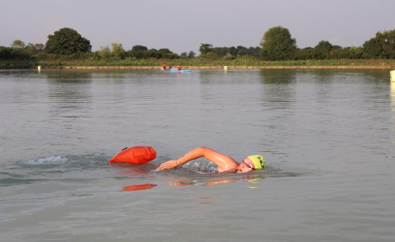 Woman swimming in lake at West Country Water Park near Bristol - credit West Country Water Park