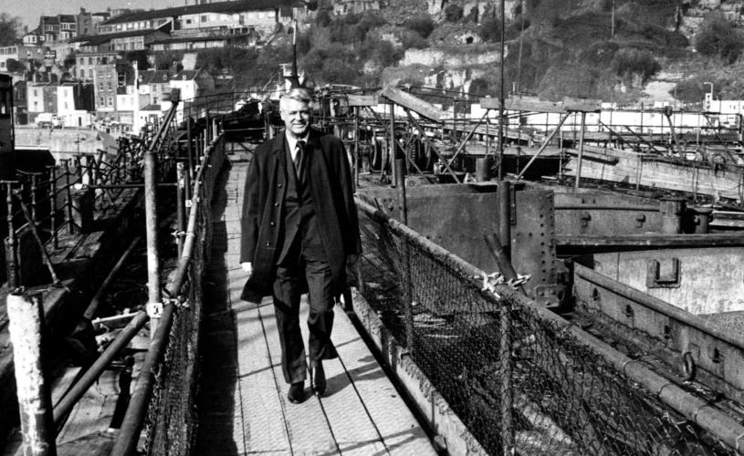A black and white image of Cary Grant walking along Bristol harbourside - credit Bristol Post