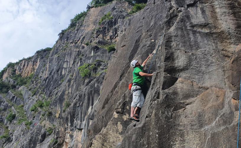 People climbing up cliff - credit Up & Under Adventures