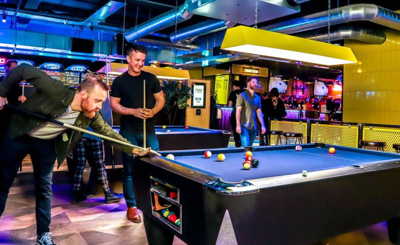 A group of men plaing pool - credit King Pins