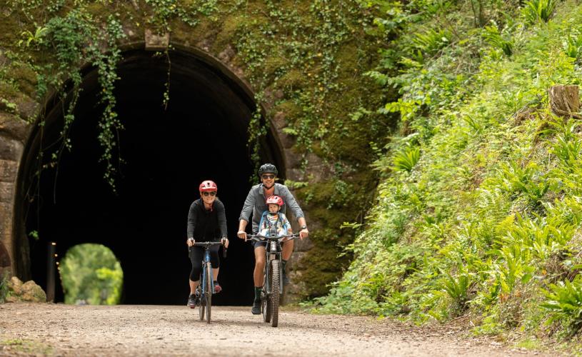 A family cycling on the Strawberry Line path in North Somerset - credit Visit West