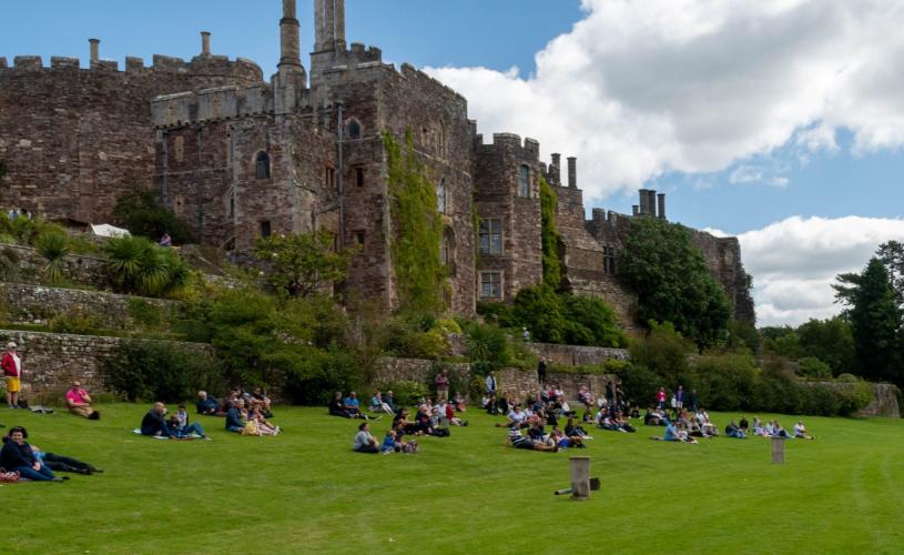People on lawn at Berkeley Castle near Bristol - credit Berkeley Castle