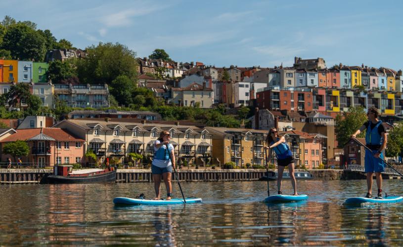 Paddleboarders in front of Hotwells on Bristol Harbourside - credit Visit West