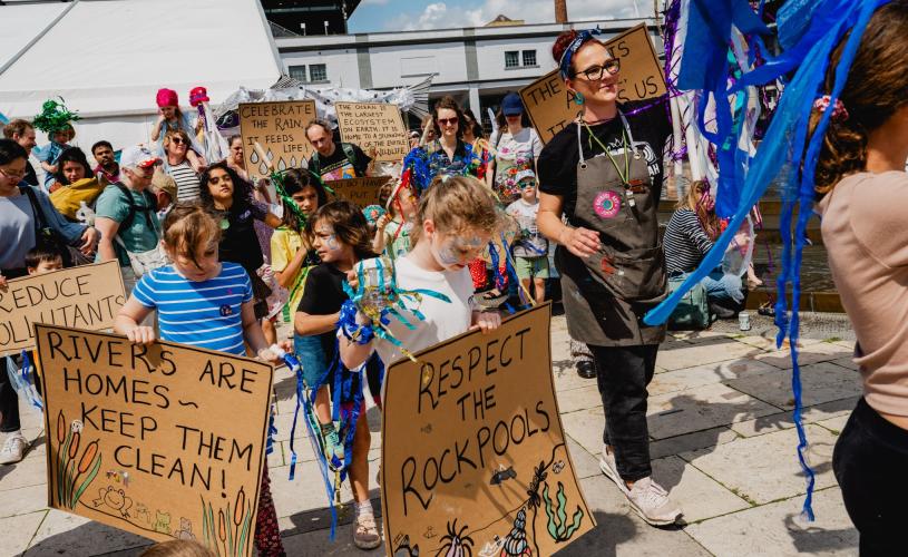 Children with signs at the Festival of Nature in Bristol