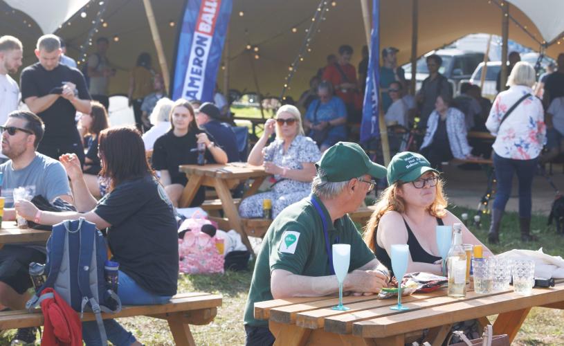 People sat down at Bristol International Balloon Fiesta - Credit Paul Box