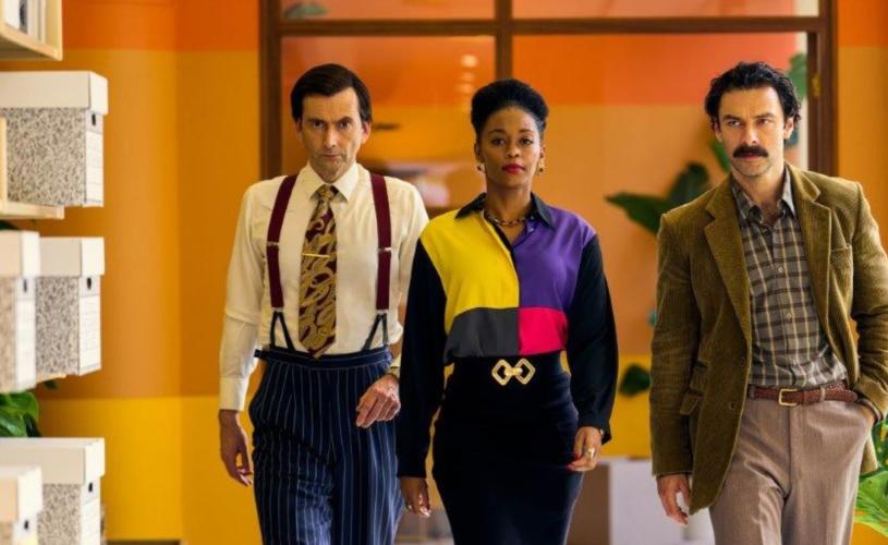 Cast of Rivals walking in hallway - credit Disney+
