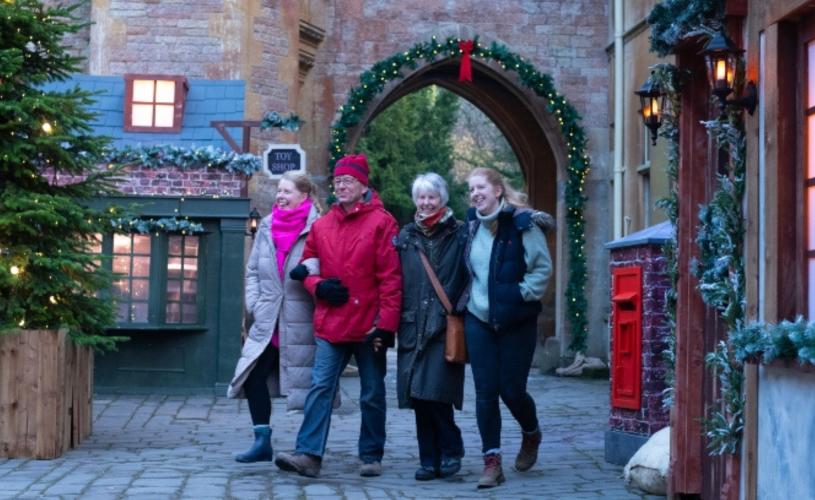 Visitors exploring the festive courtyard at Tyntesfield - credit National Trust / Steve Haywood