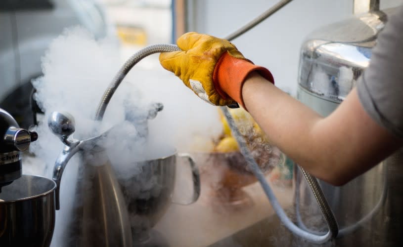 Person using liquid nitrogen at Brozen Bar in Bristol