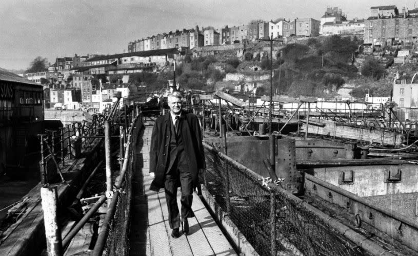 A black and white image of Cary Grant walking along Bristol's Harbourside - credit Bristol Post