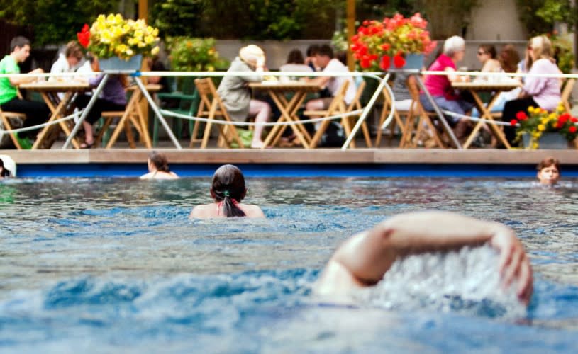 People swimming in outdoor pool