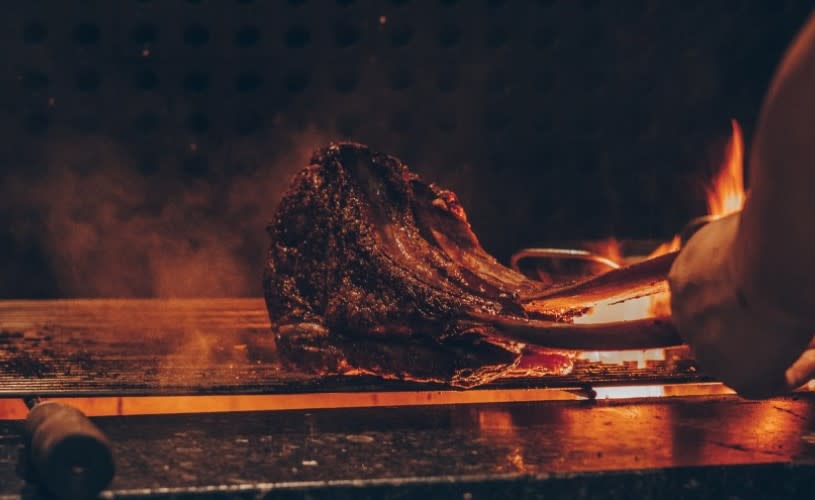 Steak being seared on grill