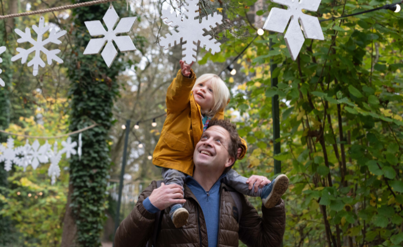 Man and child on Christmas trail at Bristol Zoo Project