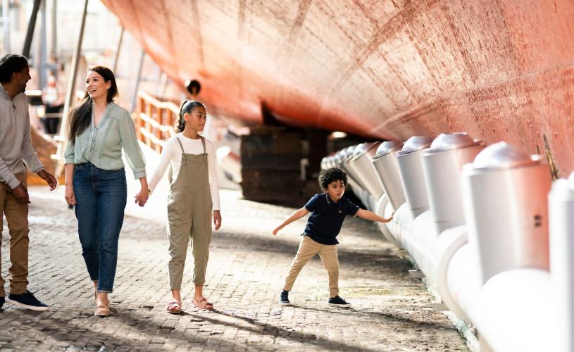 A family exploring the dry dock at Brunel's SS Great Britain, Bristol - credit Brunel's SS Great Britain