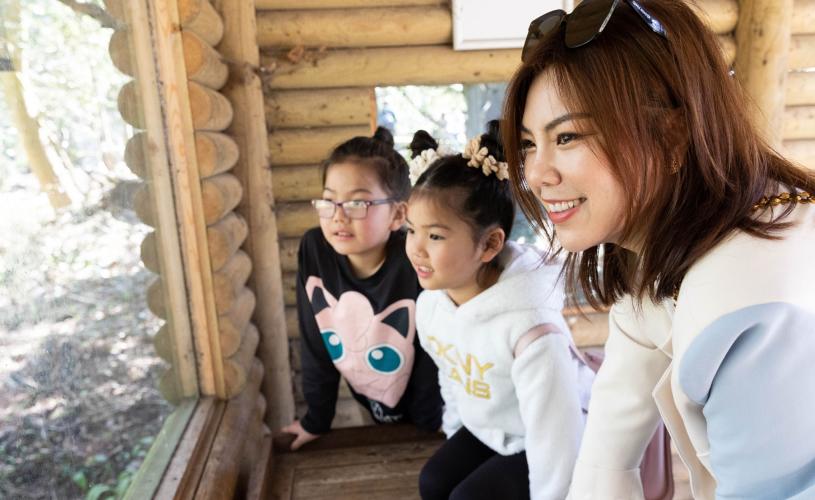 A family looking at geladas in a viewing platform at Bristol Zoo Project - credit Bristol Zoo Project