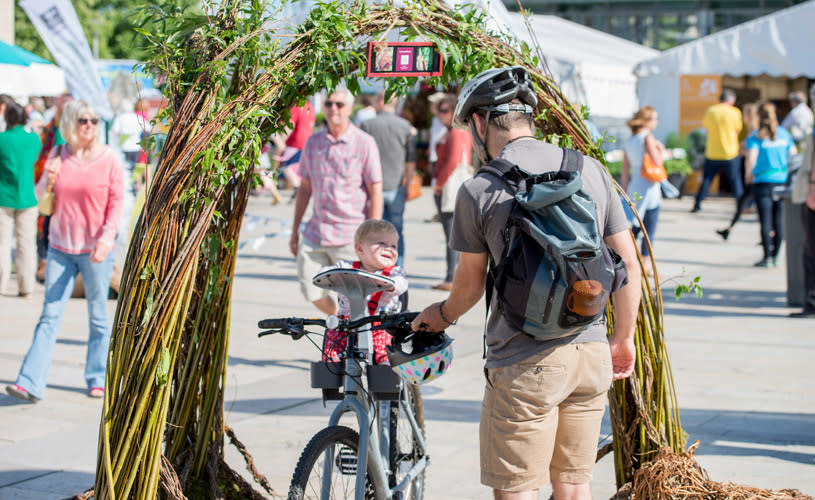 A father and his baby at the Festival of Nature on Bristol's Harbourside - credit Jon Craig
