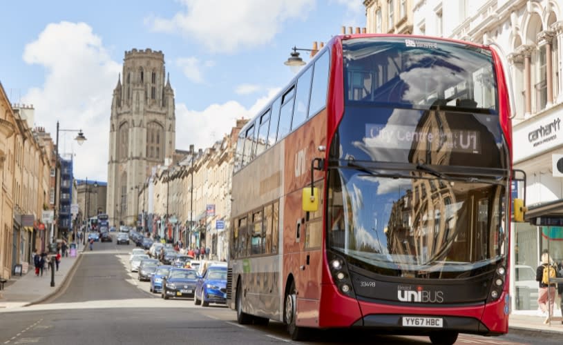 A red and black Bristol U1 Unibus driving along Park Street in central Bristol - First Bus
