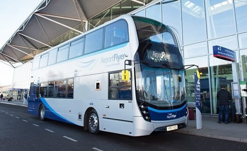 A grey double decker bus outside Bristol Airport