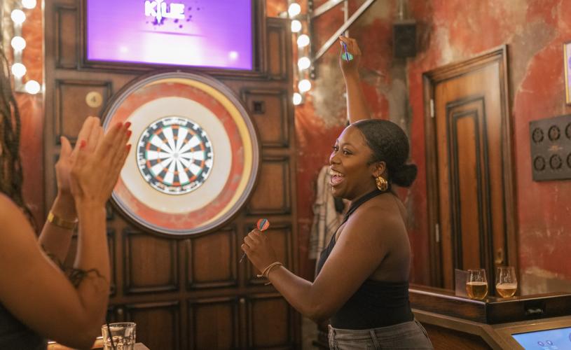 Person playing darts at Flight Club Bristol - credit Flight Club