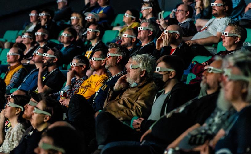 Audience watching a film at the Forbidden Worlds Film Festival in the Bristol Aquarium cinema on the Harbourside - credit Robert Browne