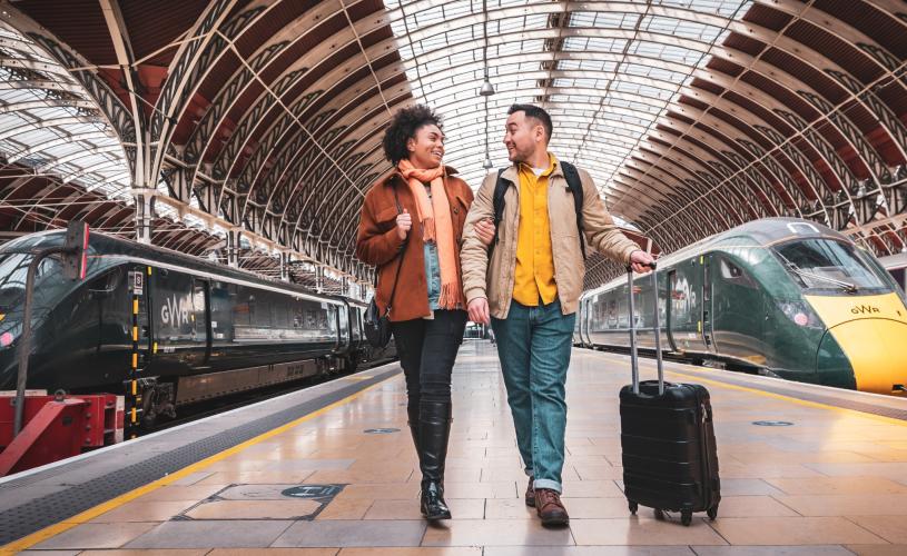 2 people with luggage on the platform at Paddington Train Station - Credit Great Western Railway