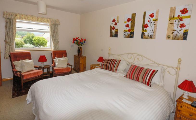 Super-King Bedroom with a countryside view in the window