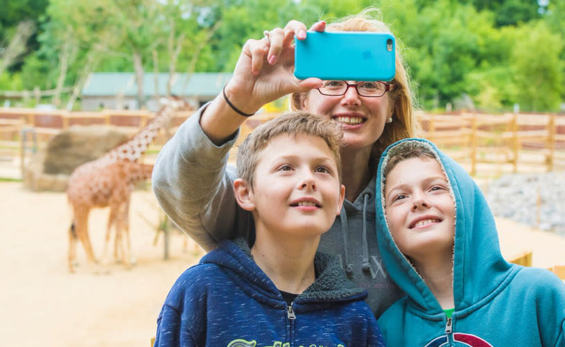 Family with giraffes at Bristol Zoo Project - credit Bristol Zoo Project