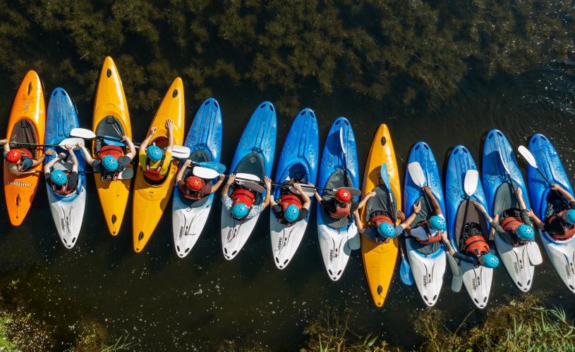 A group of people kayaking at Mendip Activity Centre, near Bristol - credit Mendip Activity Centre