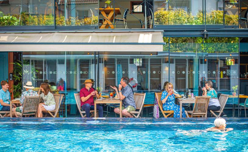 Bristol Lido people dining by pool