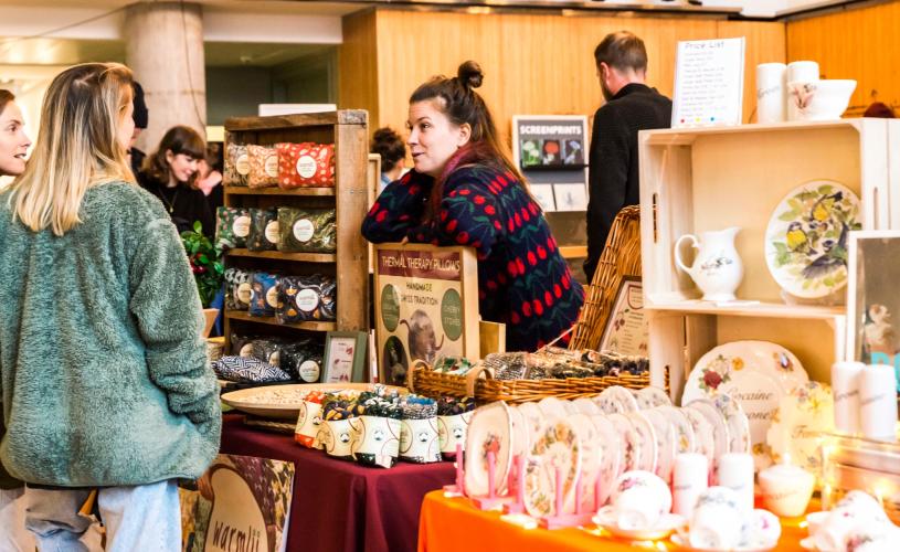 A market trader and 2 customers at the Made in Bristol gift fair - credit Jo Hounsome