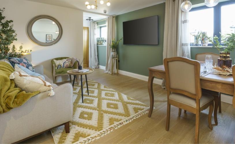 A living room with a table, sofa and tv at Mint Stays - credit Mint Stays