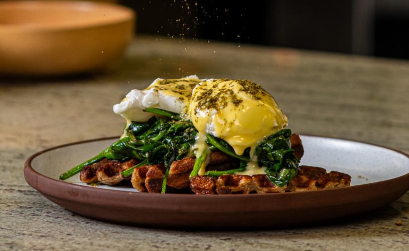 A plate of poached eggs and waffles at The Granary restaurant in central Bristol - credit The Granary