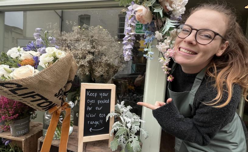Woman pointing at flowers - credit Bristol Floral Design