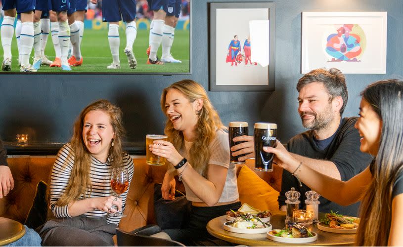 A group of friends enjoying small plates and beers at Racks