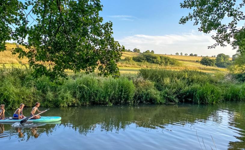Children paddle boarding along the River Avon in Bristol - credit Georgie Duckworth