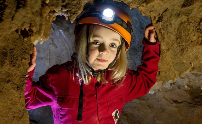 A girl taking part in a rocksports activity at Cheddar Gorge & Caves, near Bristol - credit Cheddar Gorge & Caves