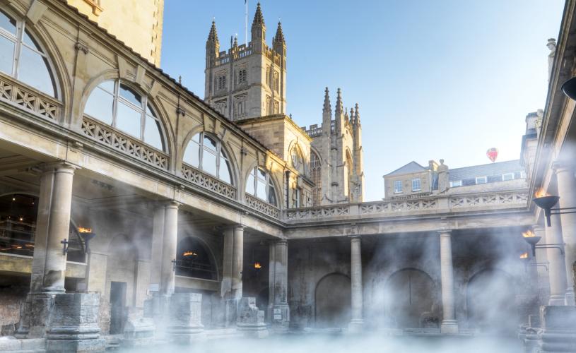 An wide shot of the Great Bath at The Roman Baths in central Bath, near Bristol