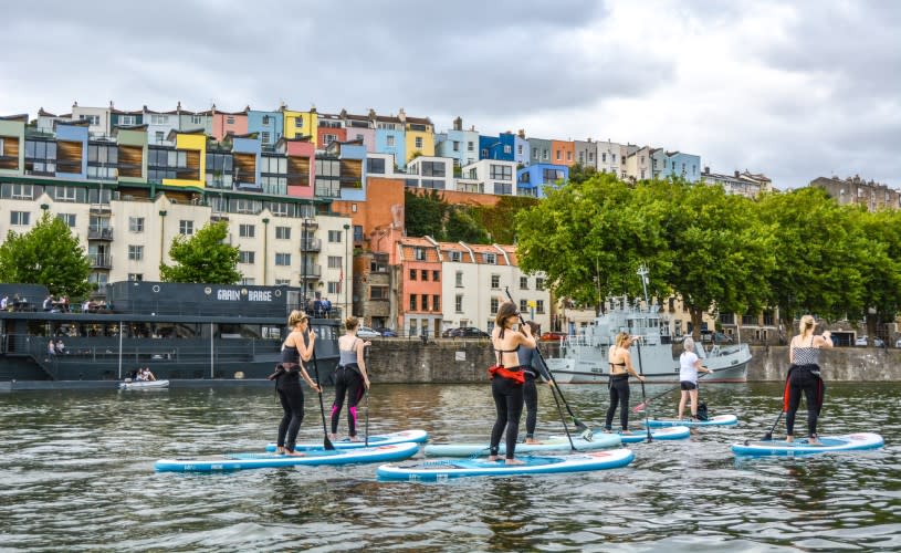 Paddleboarders in front of Hotwells and Grain Barge, Harbourside - credit SUP Bristol