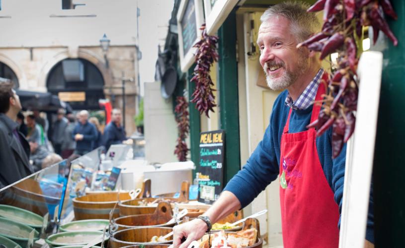 A stallholder at St Nicholas Market in Bristol's Old City - credit Paul Box