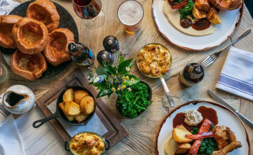 A selection of Sunday roasts on a table at Ring O' Bells pub in Compton Martin, near Bristol - credit The Ring O'Bells