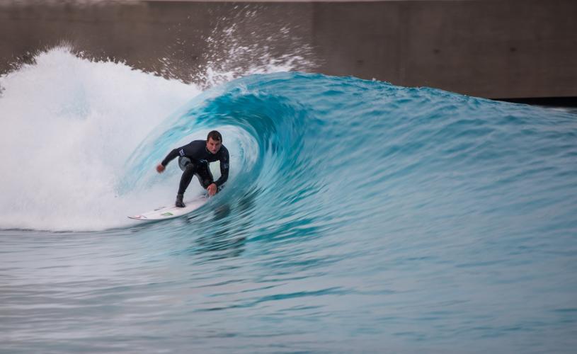 A surfer riding a wave at The Wave inland surfing lake near Bristol - credit The Wave