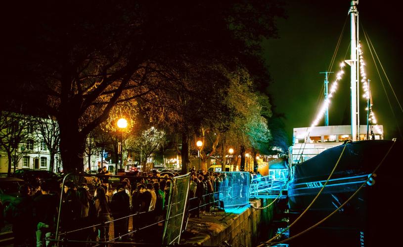 Thekla boat with queue of people outside