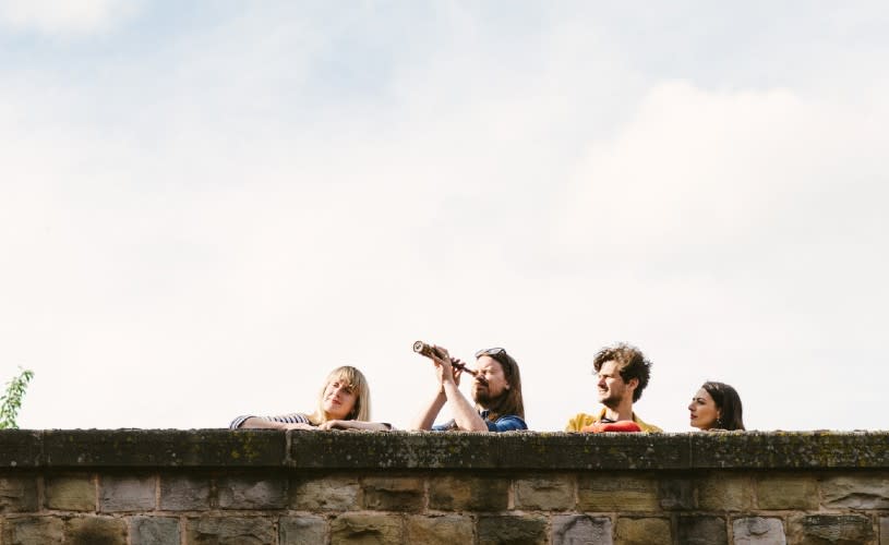 A group of people looking over a wall - Credit Treasure Hunt