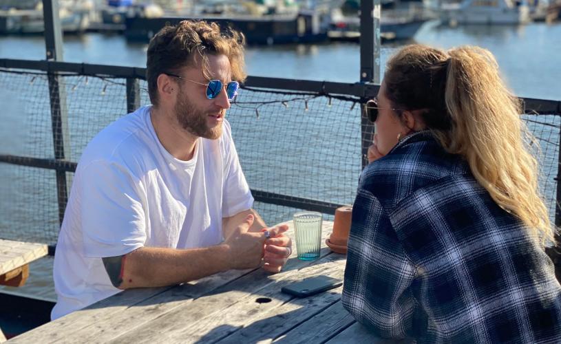 People sat on terrace at The Grain Barge in Bristol - Credit The Grain Barge