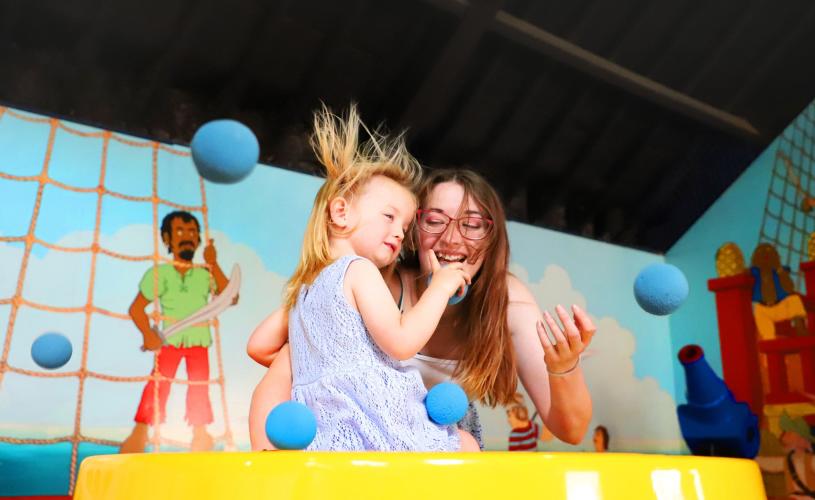 Family in play area at Wookey Hole near Bristol - credit Wookey Hole