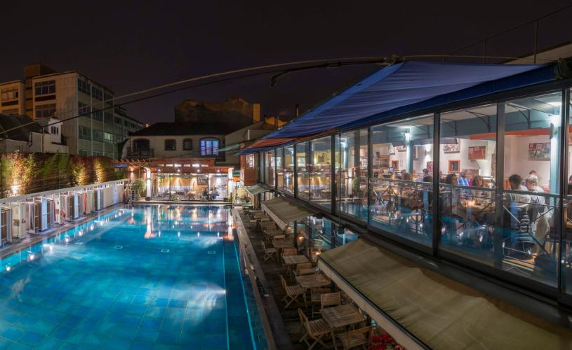 The pool and restaurant at Bristol Lido by night - credit Bristol Lido